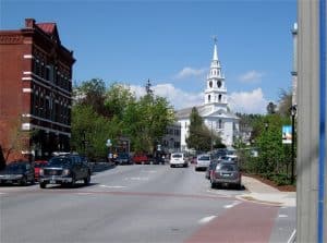 A red brick building with a white steeple in Vermont.